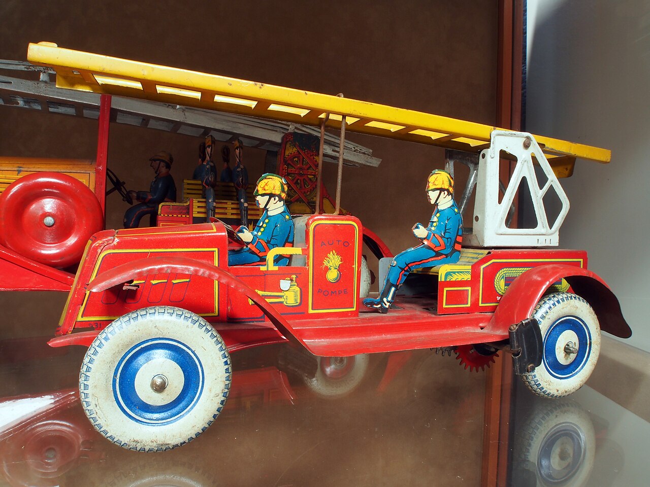 Antique toy fire truck values reference with maker, material, scale, original paint, accessories, box, condition, and demand
