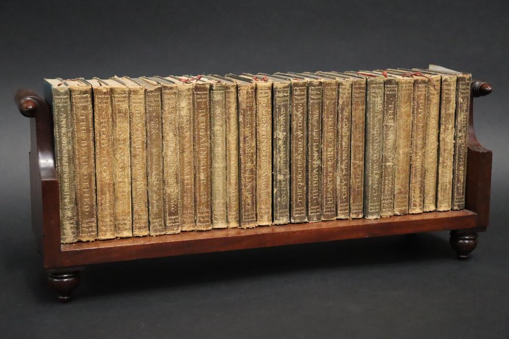 Auction comp thumbnail for Antique book shelf with rolling pin ends, along with books, Ex Derek Greengrass Antiques, approx 21cm H x 50cm W (Vickers & Hoad, Lot 112)