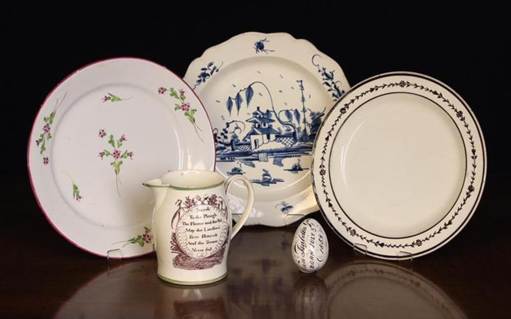 Auction thumbnail for a small group of antique pottery with cream-ware jug