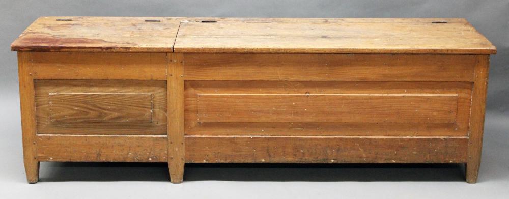 Auction comp thumbnail for Furniture: Antique primitive long wood box/bench – a neat heavy yellow pine box- bench on oak legs/feet; with two hinged lids – short/long; raised panels @front and ends; in old natural surface (Great wear); 73 ½” L X 19” D X 22 ¾” T (Good) NO SHIPPI (Roan Inc. Auctioneers & Appraisers, Lot 395)