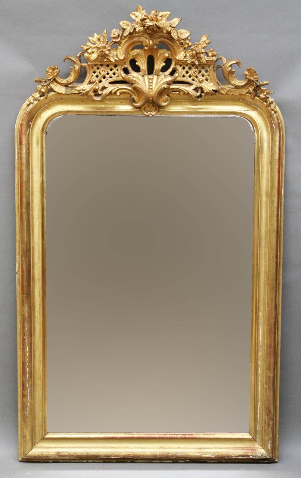 Auction comp thumbnail for Furniture: Antique Victorian over the mantle mirror – deep gilt molding framed hanging mirror with ornate over plaster wood crest in floral, basket weave & scroll designs (in mostly original condition/old crest repairs) 38” W X 65” T (Good) NO SHIPPI (Roan Inc. Auctioneers & Appraisers, Lot 525)