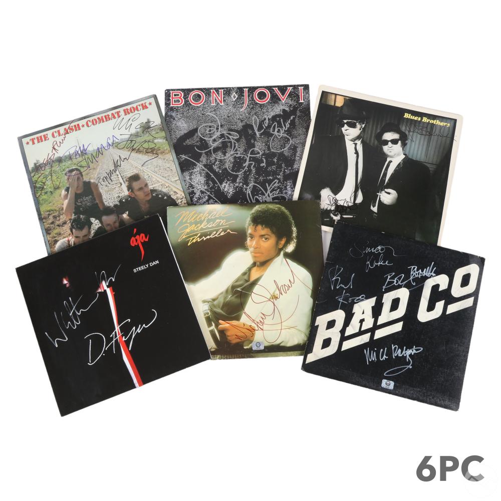 Auction photo of a collection of six signed vintage LP vinyl records (Hill Auction Gallery lot 157)