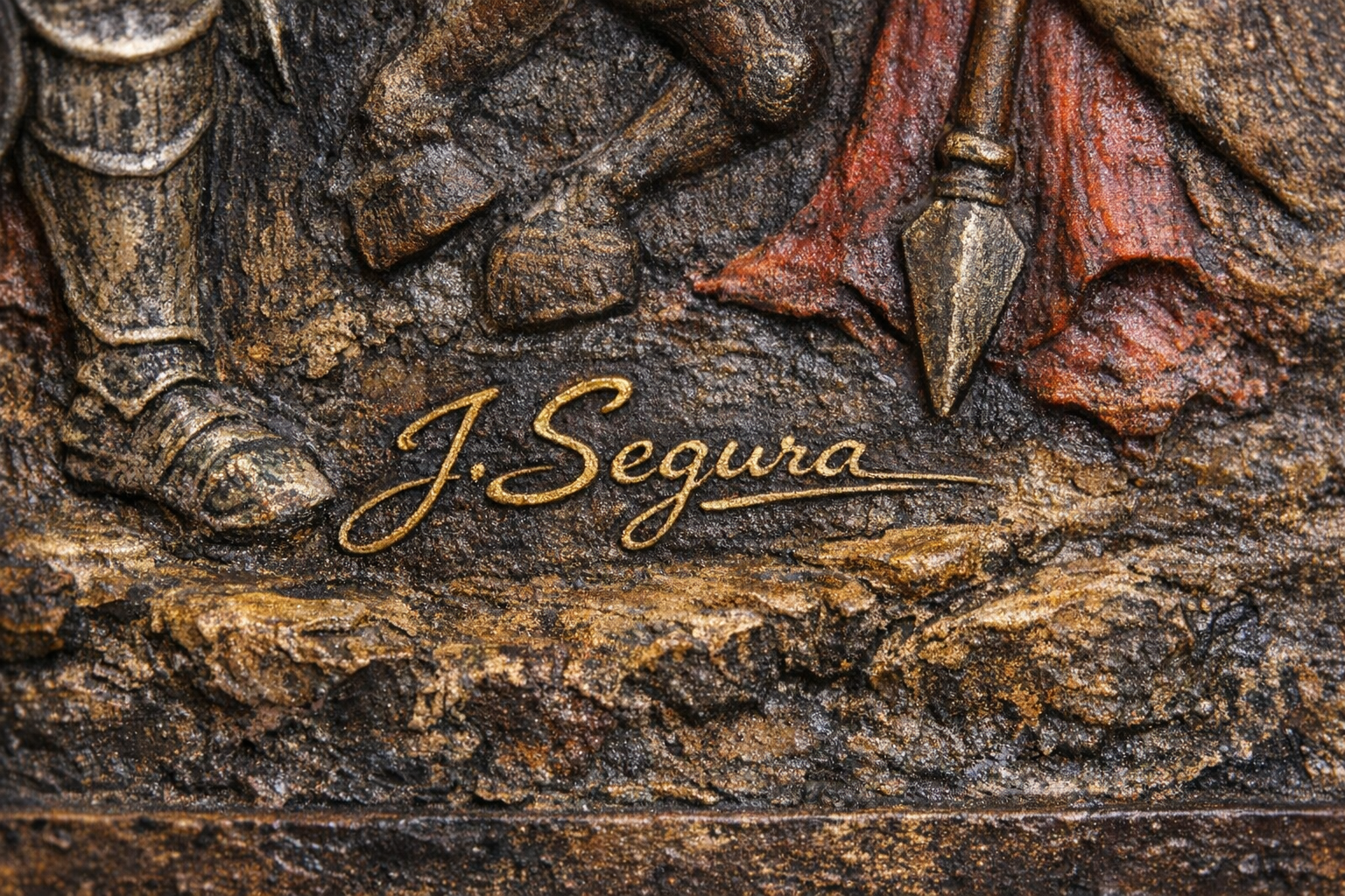 Close-up of J. Segura signature on a fiberglass art piece