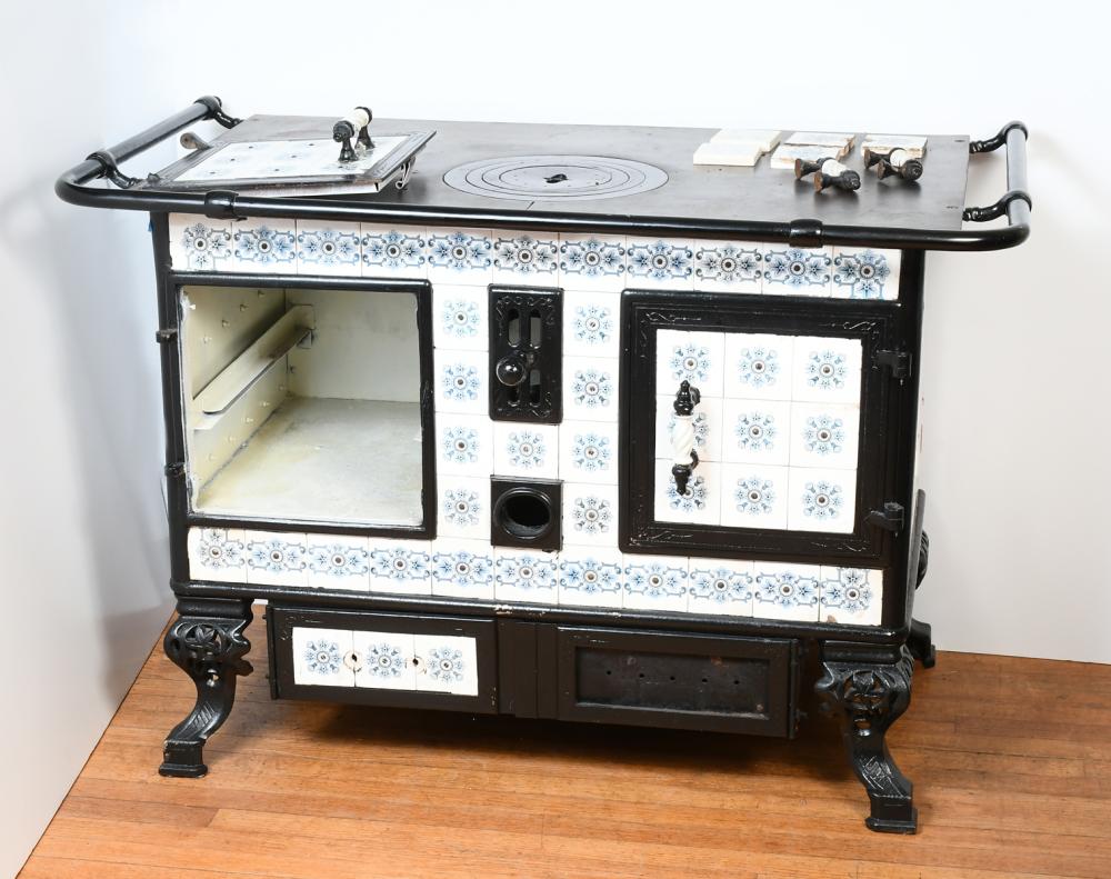 Auction comp thumbnail for TILED CAST IRON STOVE (Burchard Galleries Inc, Lot 1483)