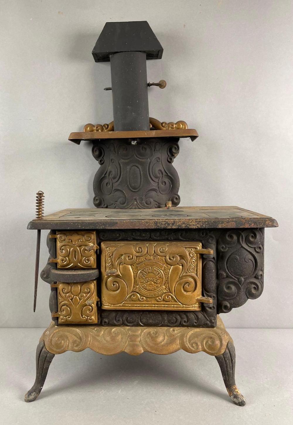 Auction comp thumbnail for Antique Dollys Favorite Cast Iron Stove and Range Sample (Matthew Bullock Auctioneers, Lot 829)