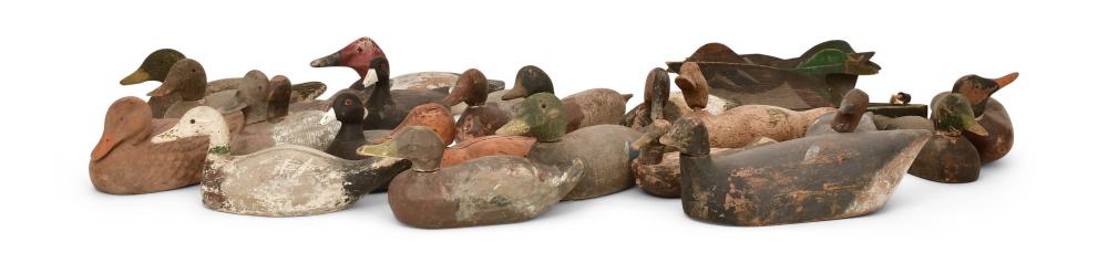 Reference image for documenting antique duck decoy identification factors including body form, head carving, paint layers, rigging, weight, maker marks, regional traits, wear, repairs, and provenance