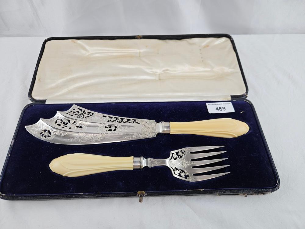 Antique sterling silver fish serving knife and fork with carved handle sold at auction