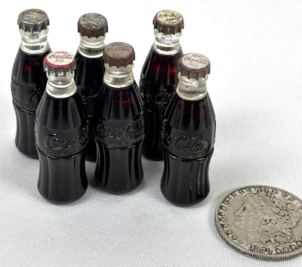 Auction comp thumbnail for Vintage 1950's Lot of 6 Coca-Cola Bottle Lighters (One Source Auctions, Lot 9)