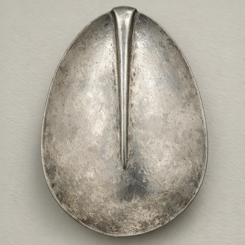 Reference photo of the back of an early rat-tail spoon bowl