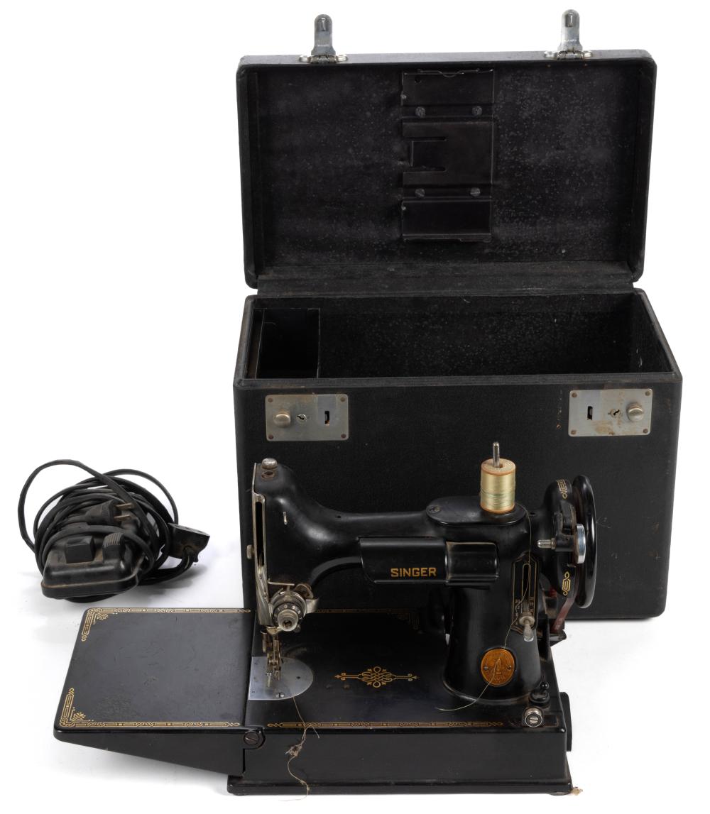 Auction comp thumbnail for SINGER MODEL NO. 221 / FEATHERWEIGHT PORTABLE TABLE-TOP ELECTRIC SEWING MACHINE (Jeffrey S. Evans & Associates, Lot 2053)