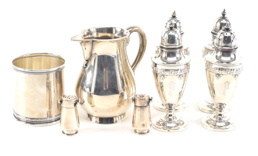 Auction comp thumbnail for Sterling silver tableware. To include: 1) Cartier julep cup. Marked. 3.5in high. 2) Heavy English sterling silver cream pitcher. 3) Pair of small Mexican salt and pepper shakers. 4) Set of 4 Wallace baroque style shak... (Tremont Auctions, Lot 83)