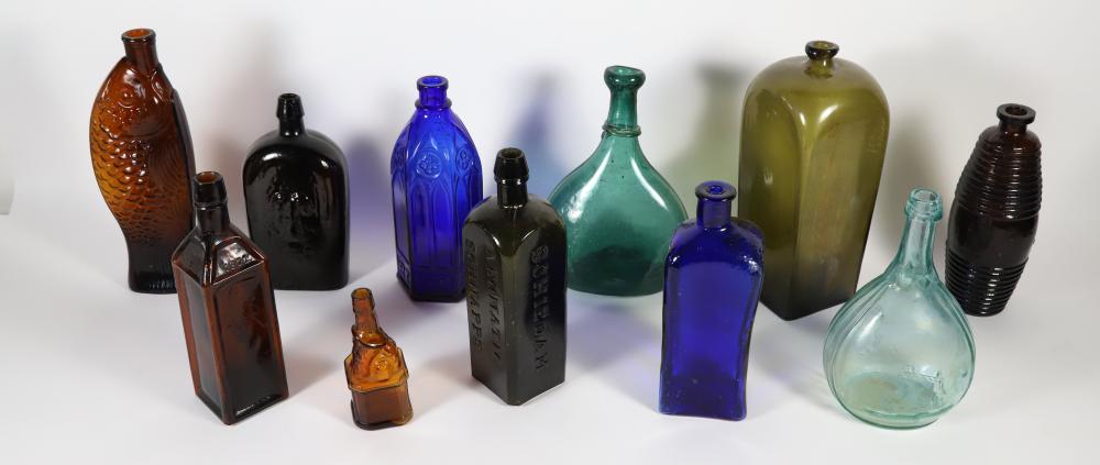 Auction photo: collection of ten antique bottles including bitters and flasks, Rafael Osona Auctions lot 518