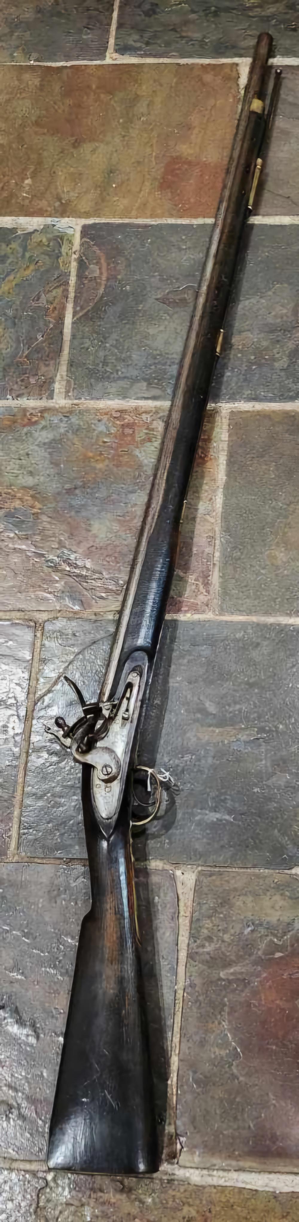 Reference image for antique flintlock rifle identification including maker marks, lock plate, barrel marks, stock, fittings, repairs, condition, provenance, photos, and legal context