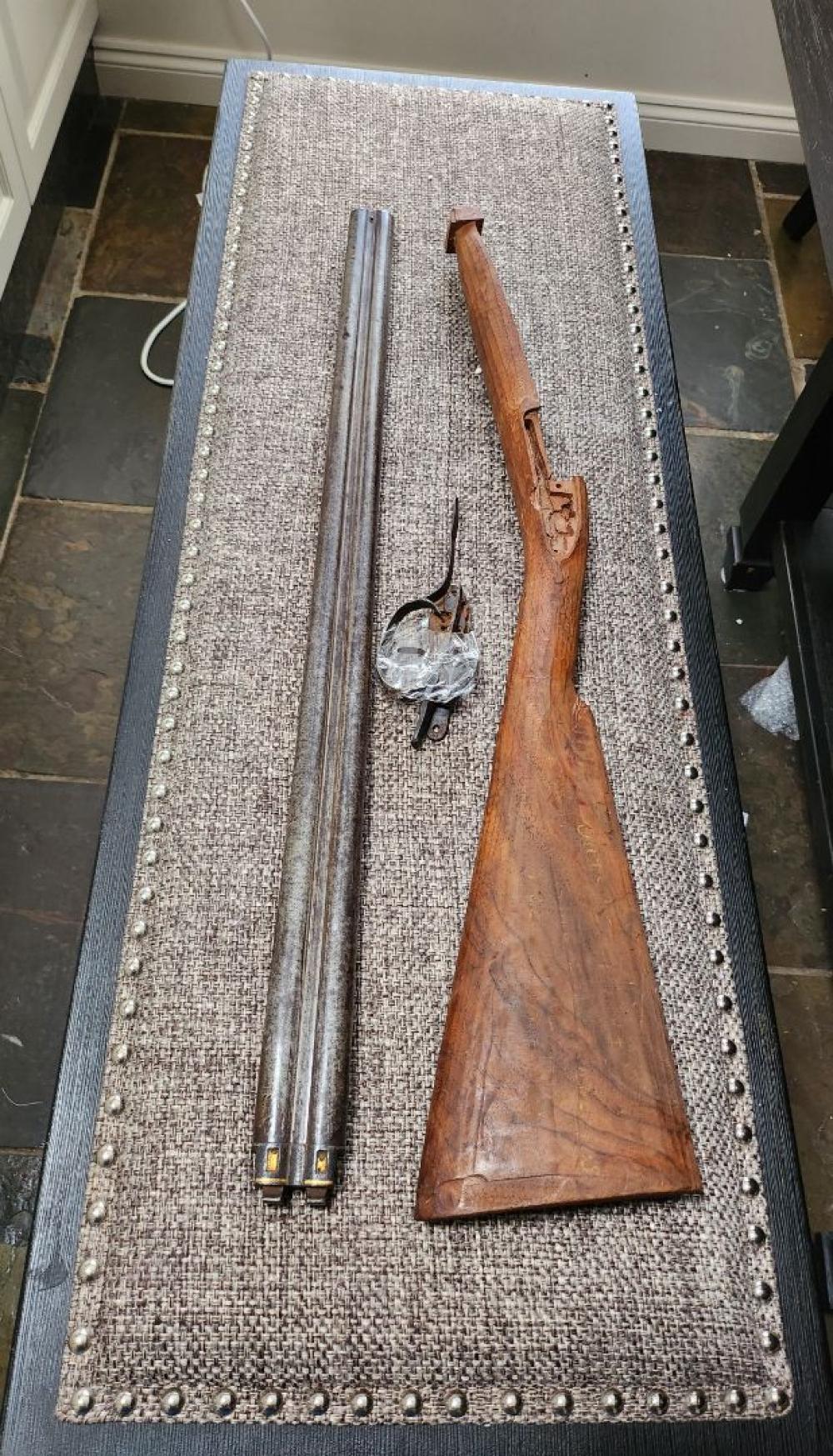 Antique firearms displayed safely for valuation with visible maker, barrel, stock, finish, and condition details