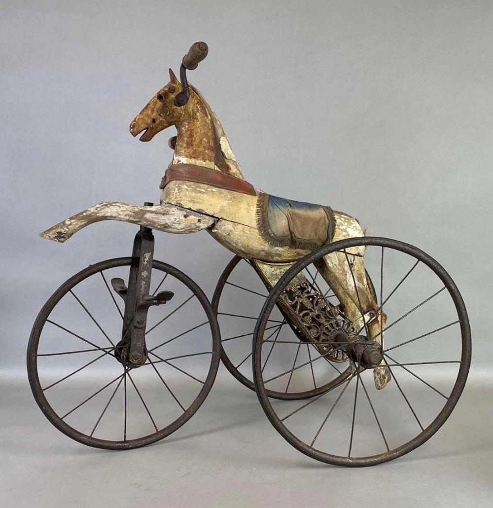 Antique wood and cast iron horse tricycle auction comparable