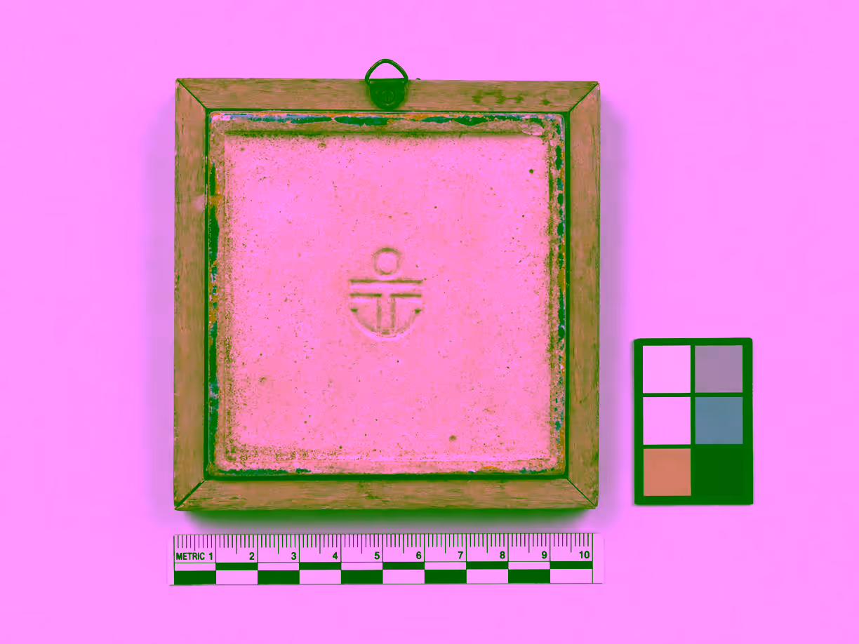 Correct documentation photograph of a ceramic tile reverse, square to the lens, with an abstract impressed mark, color card, and metric scale.