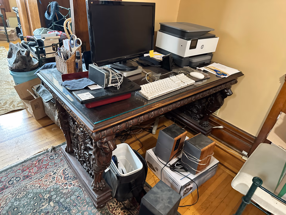 Victorian Revival desk photographed in warm interior light for appraisal research